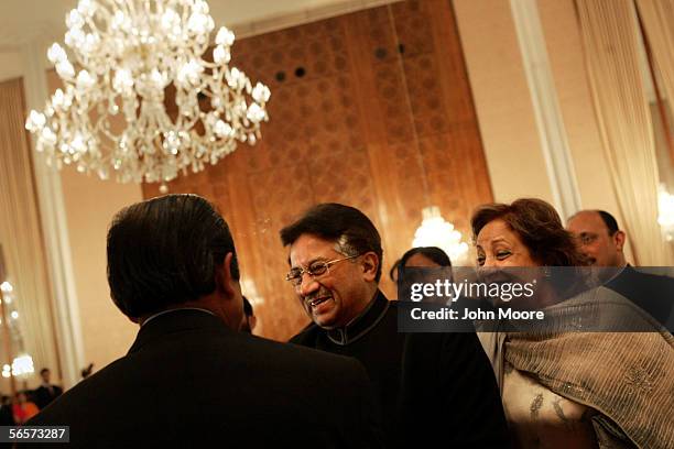 Pakistani President Pervez Musharraf and First Lady Sehba Musharraf greet guests during an Eid celebration at the Presidential Palace in Islamabad,...