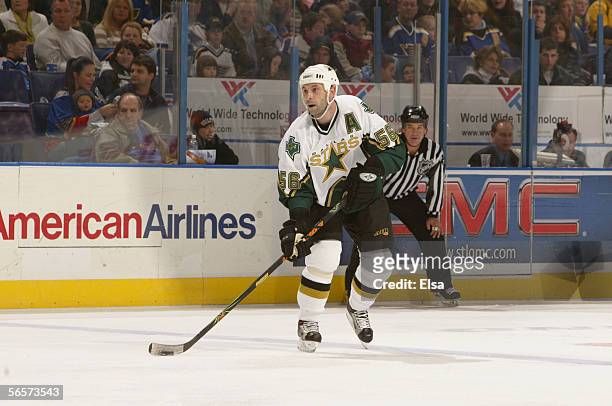 Defenseman Sergei Zubov of the Dallas Stars skates with the puck against the St. Louis Blues on December 26, 2005 at the Savvis Center in St. Louis,...