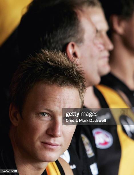 Nathan Brown of the Tigers talks with teammates during the Richmond Football Club photo session at the Punt Road Oval January 12, 2006 in Melbourne,...