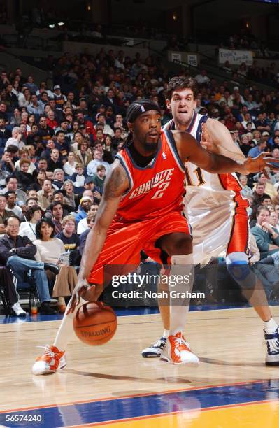 Melvin Ely of the Charlotte Bobcats moves the ball against Zarko Cabarkapa of the Golden State Warriors at the Arena in Oakland on December 2, 2005...