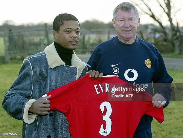 Manchester, UNITED KINGDOM: French international defender Patrice Evra is unveiled by Manchester United manager Sir Alex Ferguson after signing for...
