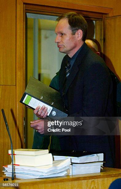 Armin Meiwes in handcuffs attends his retrial on January 12, 2006 at the District Court in Frankfurt, Germany. Meiwes was convicted two years ago of...