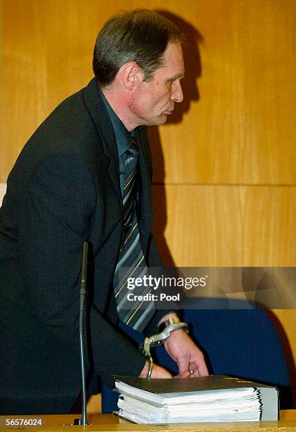 Armin Meiwes in handcuffs attend his retrial on January 12, 2006 at the District Court in Frankfurt, Germany. Meiwes was convicted two years ago of...