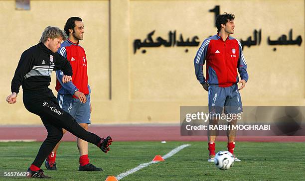 Dubai, United Arab Emirates: Bayern Munich players goalkeeper Oliver Kahn, Iranian midfielder Ali Karimi and midfielder Michael Ballack attend a...