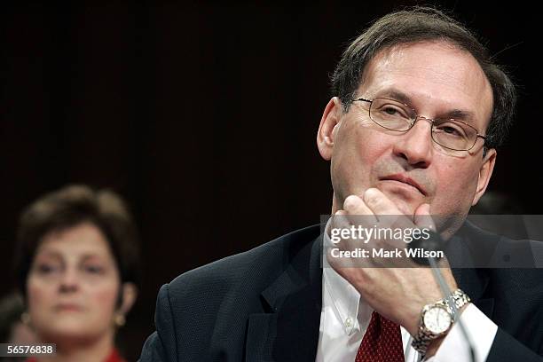 Supreme Court nominee, Judge Samuel Alito , answers questions as his wife, Martha , looks on during the fourth and likely final day of his...