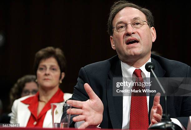 Supreme Court nominee, Judge Samuel Alito , answers questions as his wife, Martha , looks on during the fourth and likely final day of his...