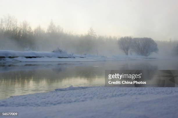 Low level fog hangs in the air early in the morning at the Kuerbin reservoir on January 8, 2006 in Yichun City of Heilongjiang Province, northeast...