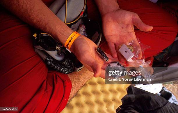 Man shows his drugs during the Solipse festival June 22, 2001 in Zambia. The group of German trance lovers decided to organize the Solipse festival...