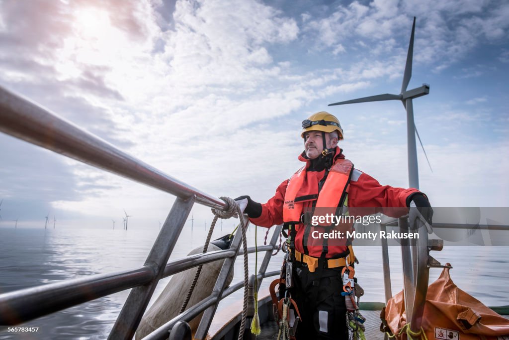 Portrait of engineer on boat at offshore windfarm