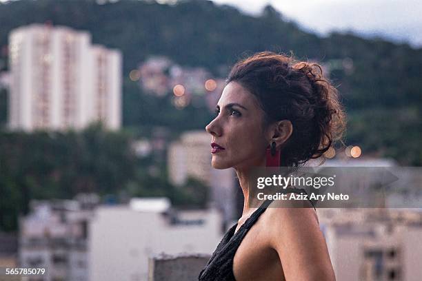 profile portrait of fashion model wearing black dress and looking up - hot female models stock pictures, royalty-free photos & images