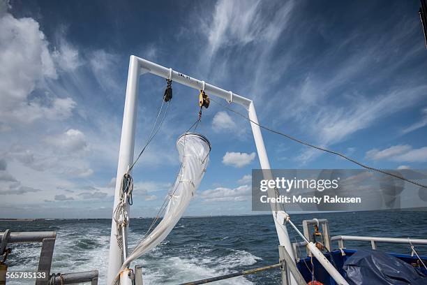 plankton net hanging on stern of research ship - plankton stock pictures, royalty-free photos & images