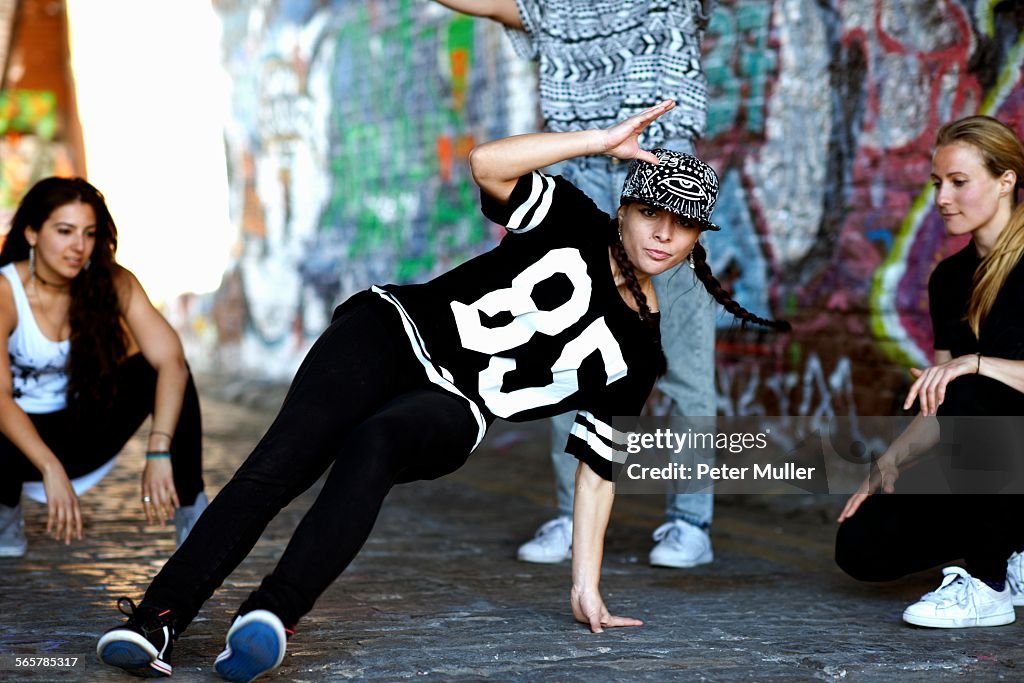 Young woman breakdancing