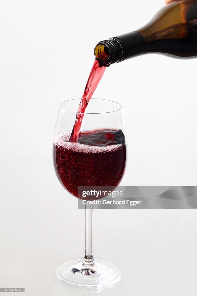 Wine being poured from bottle