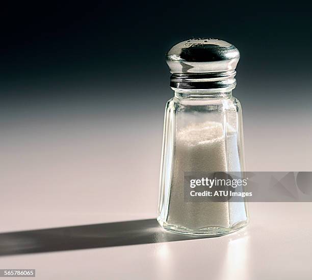 salt shaker with shadow - salt shaker stockfoto's en -beelden