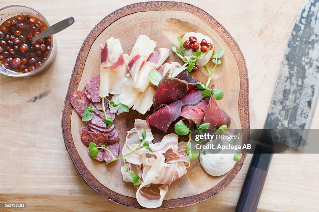 High angle view of dish on wooden plate in kitchen