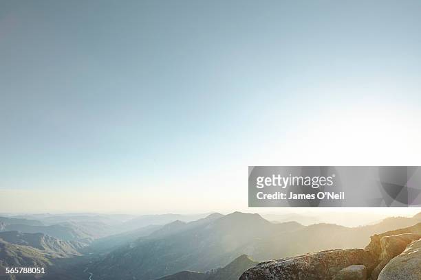 sunset over valley hills - landschaft stock-fotos und bilder