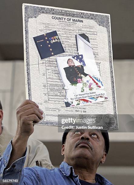 Bill Babbitt holds the death certificate of his brother, executed killer Manny Babbitt, during a rally opposing the death penalty January 12, 2005 on...