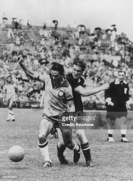 Brazilian forward Didi and Hungarian full-back Mihaly Lantos in action during a World Cup quarterfinal match at the Wankdorf Stadium, Berne...