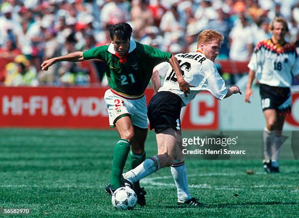 Erwin Sanchez of Bolivia and Matthias Sammer of Germany in action during the World Cup match between Germany and Bolivia on June 17, 1994 in Chicago,...
