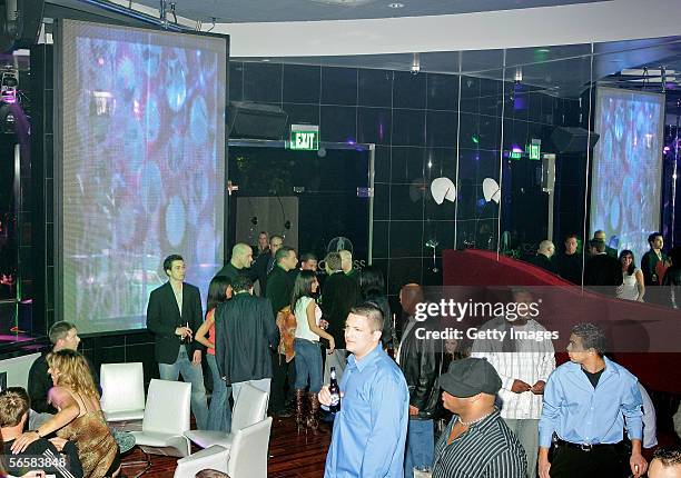 Patrons attend the grand opening of the Seamless Adult Ultra Lounge early December 18, 2005 in Las Vegas, Nevada.