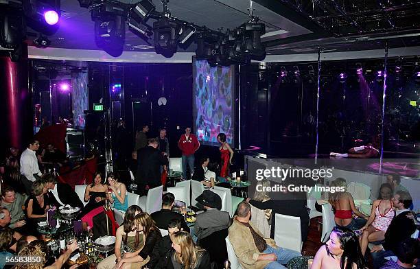 Patrons attend the grand opening of the Seamless Adult Ultra Lounge early December 18, 2005 in Las Vegas, Nevada.