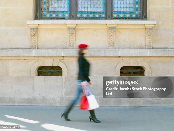 blurred view of caucasian woman shopping on city sidewalk - paris fashion stock pictures, royalty-free photos & images