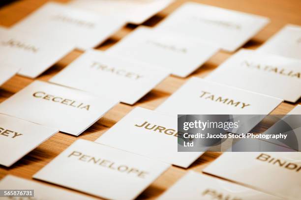 close up of name tags on table - namensschild stock-fotos und bilder