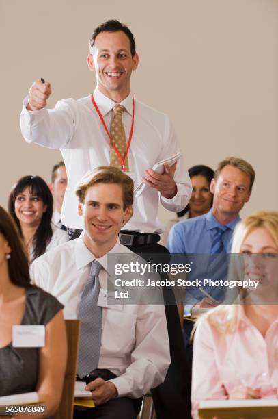 caucasian businessman asking questions in presentation - england training session and press conference stock pictures, royalty-free photos & images