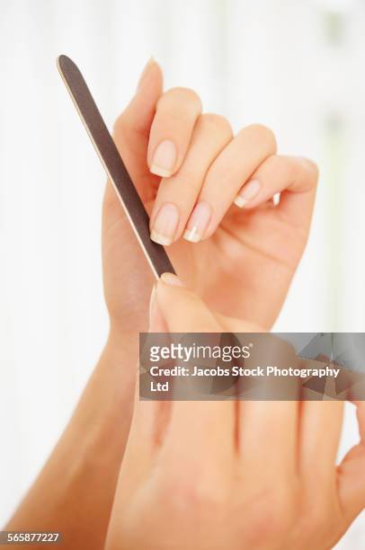 caucasian woman filing fingernail - lime photos et images de collection