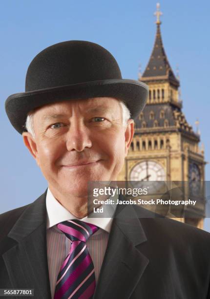 caucasian businessman standing near big ben clock tower, london, middlesex, united kingdom - シルクハット ストックフォトと画像