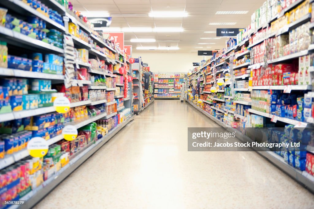 Shelves in grocery store aisle