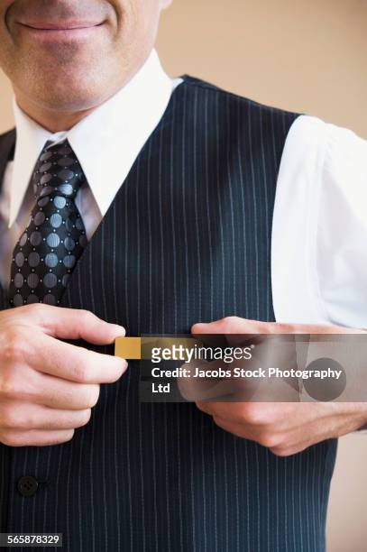 caucasian butler wearing name tag in hotel - namensschild stock-fotos und bilder