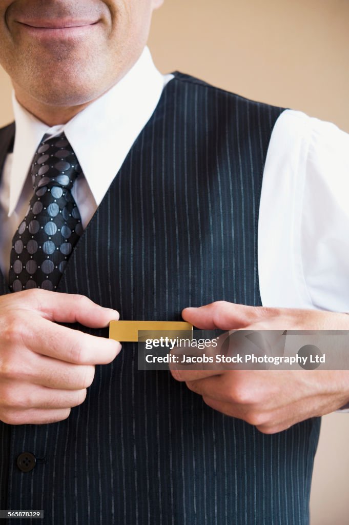 Caucasian butler wearing name tag in hotel