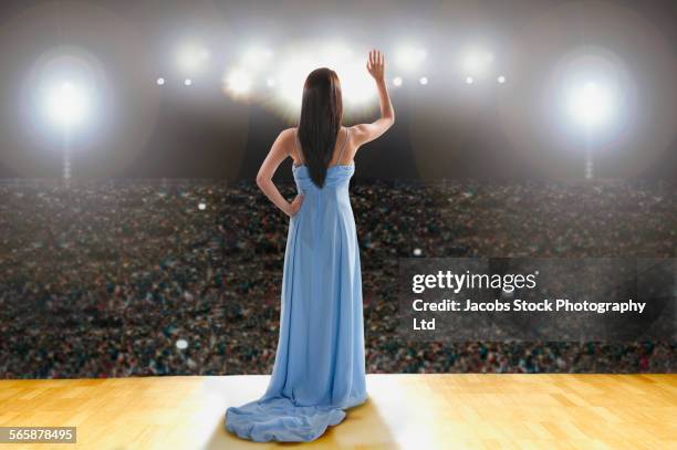 hispanic celebrity posing in gown on stage - woman fame stock pictures, royalty-free photos & images