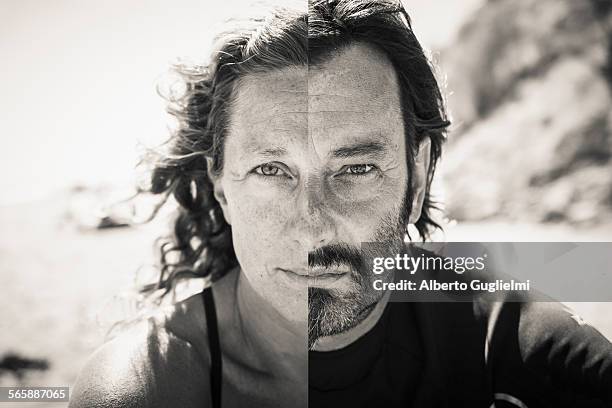 split view of caucasian man and woman on beach - portrait mann schwarz weiß stock-fotos und bilder