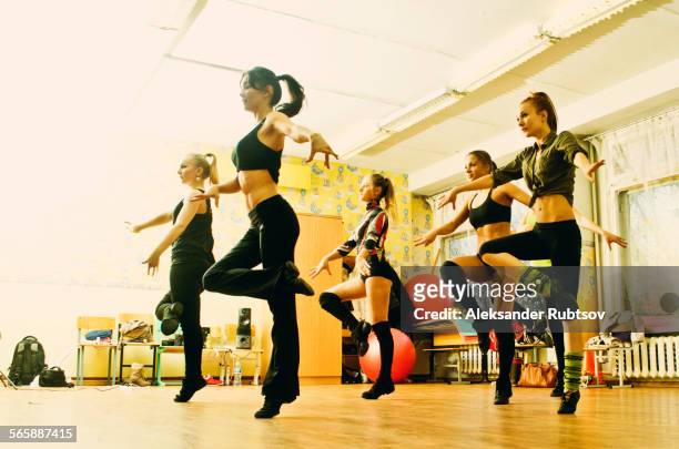 Caucasian dancers rehearsing in studio