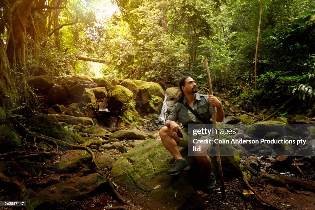 Hawaiian scientist doing field research in forest