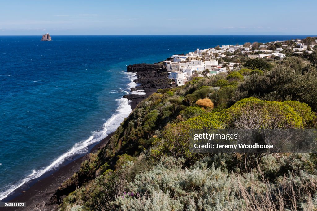 High angle view of cliff and ocean on Stromboli coastline, Messina, Sicily
