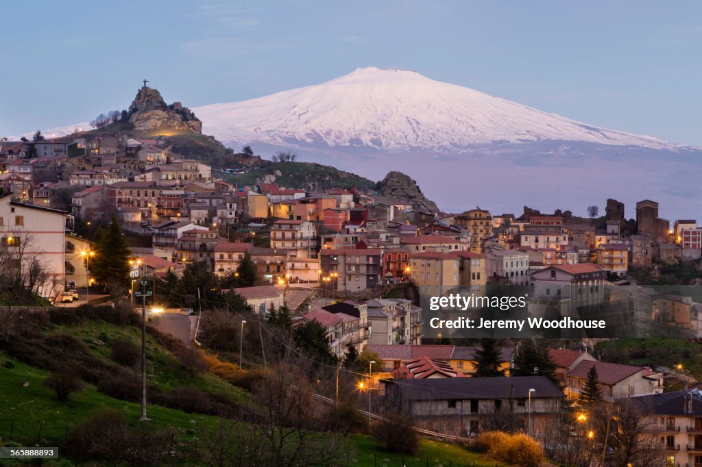 High angle view of Mt Etna over Cesaro cityscape, Messina, Sicily