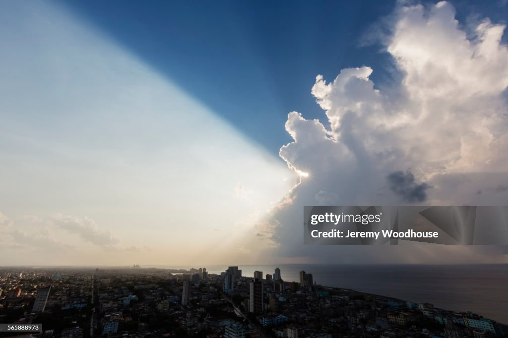 Storm clouds and sunbeams over Havana cityscape, Havana, Cuba