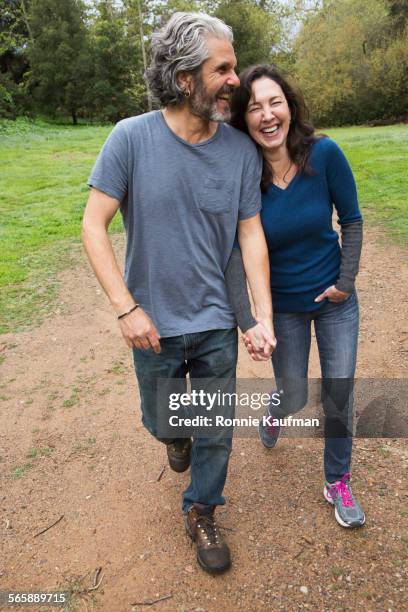 caucasian couple walking on dirt path in park - california state route 58 stock pictures, royalty-free photos & images