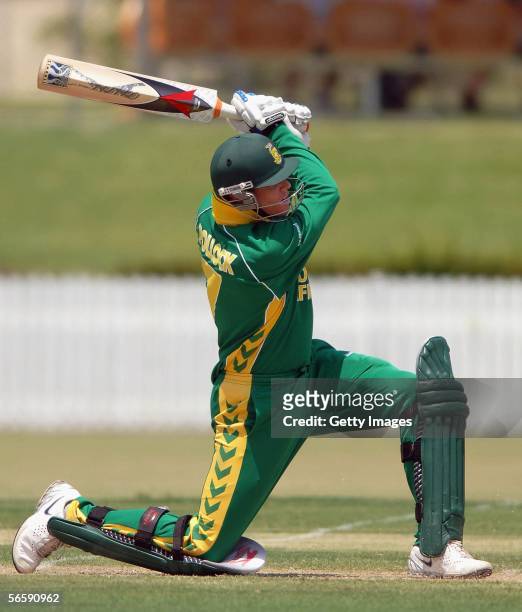 Shaun Pollock of South Africa drives the ball during the tour match against the Queensland Academy of Sport team at Allan Border Field January 13,...
