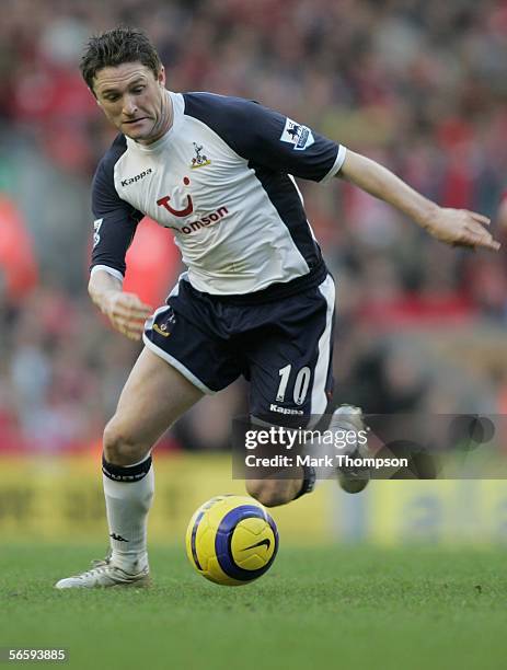 Robbie Keane of Tottenham Hotspur controls the ball during the Barclays Premiership match between Liverpool and Tottenham Hotspur at Anfield on...