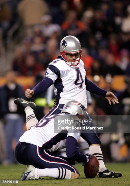 Adam Vinatieri of the New England Patriots attempts a field as Josh Miller holds against the Denver Broncos during the AFC Divisional Playoff game on...