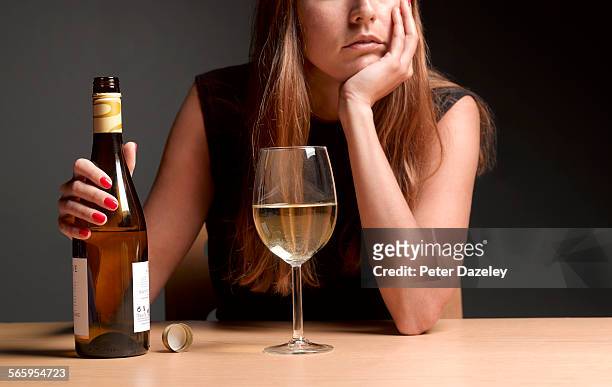 alcoholic women with depression - copa fotografías e imágenes de stock