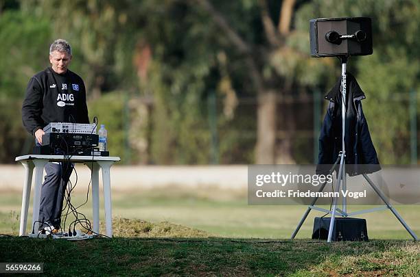 Bus driver Jurgen Ahlert adjusts audio equipment during the Hamburger SV training camp on January 15, 2006 in La Manga near Cartagena, Spain.