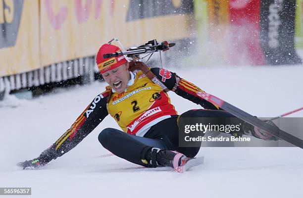 Kati Wilhelm of Germany struggles after crossing the finish line during the women's 10 km pursuit of the Biathlon World Cup on January 15, 2006 in...