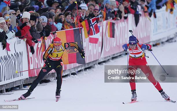 Kati Wilhelm of Germany and Liv Grete Poiree of Norway fight for the finish during the women's 10 km pursuit of the Biathlon World Cup on January 15,...