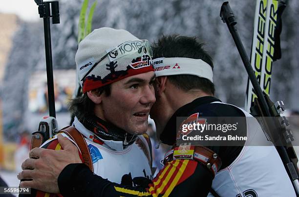 Sven Fischer of Germany congratulates his team mate Michael Roesch after the men's 12.5 km pursuit of the Biathlon World Cup on January 15, 2006 in...