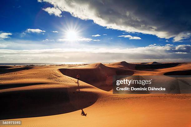 runner across desert - maspalomas imagens e fotografias de stock